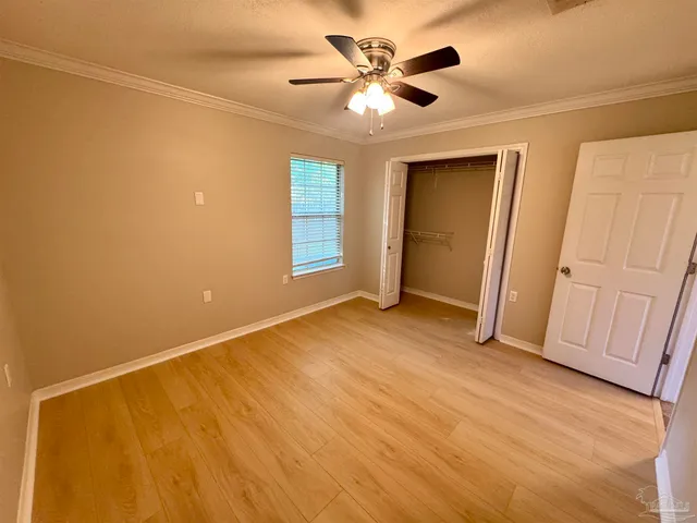 a view of an empty room and a window