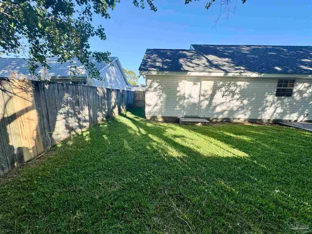 a view of a yard of front a house
