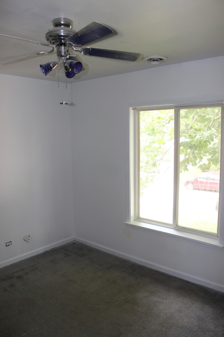 225 Bedford Road Bolingbrook, IL 60440 - Photo 22 of 27 an empty room with a window