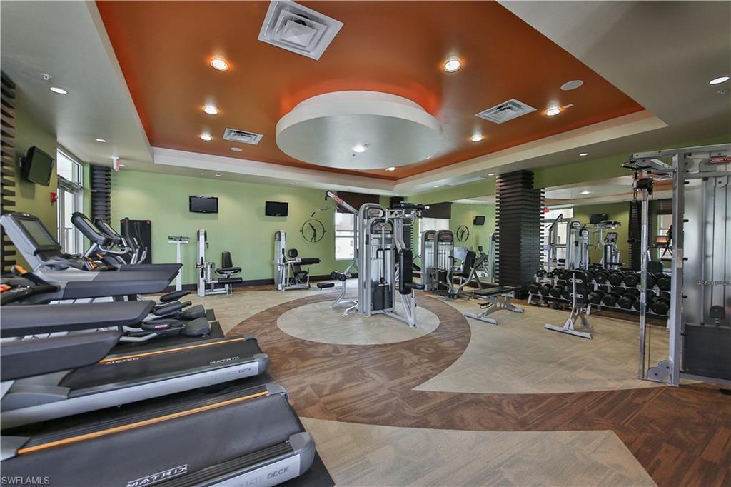 9115 Strada Place, Unit 5501 Naples, FL 34108 - Photo 19 of 31 a room with lots of tables and chairs
