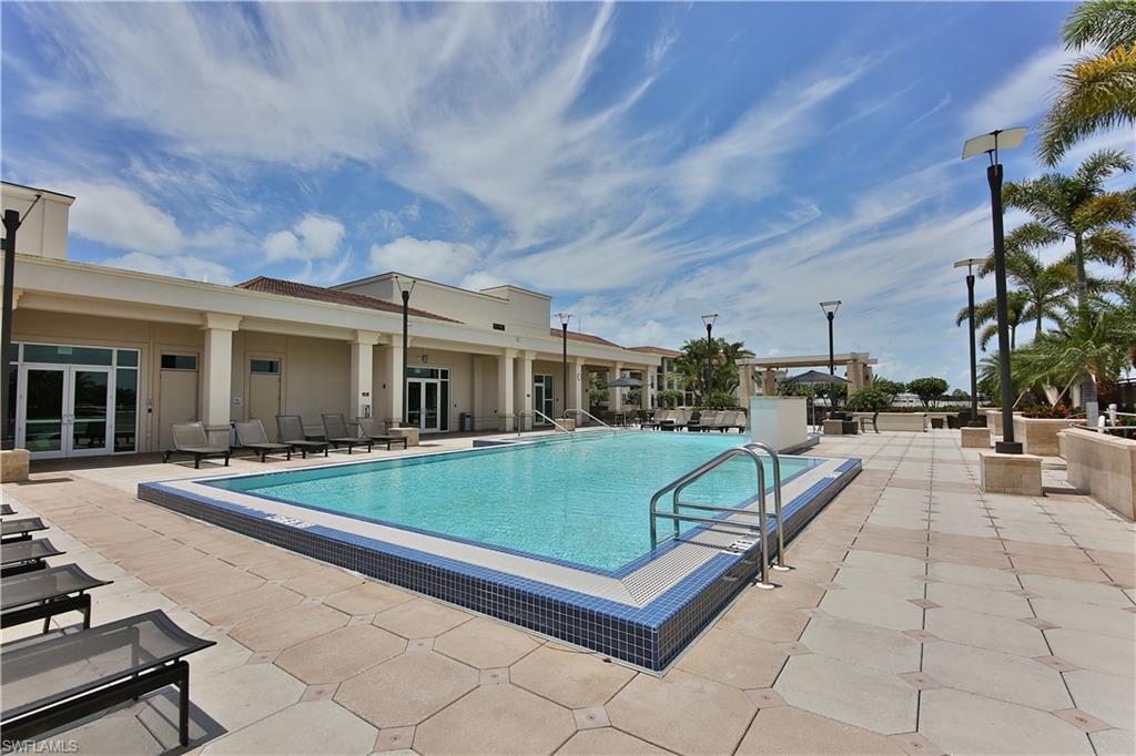 9115 Strada Place, Unit 5501 Naples, FL 34108 - Photo 23 of 31 a view of a house with backyard porch and sitting area