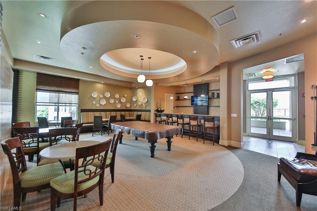9115 Strada Place, Unit 5501 Naples, FL 34108 - Photo 28 of 31 a view of a dining room with furniture and window