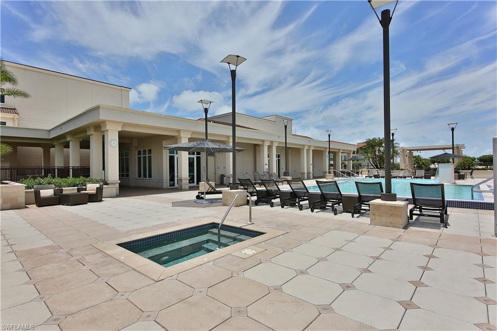 9115 Strada Place, Unit 5501 Naples, FL 34108 - Photo 29 of 31 a view of a swimming pool with chairs