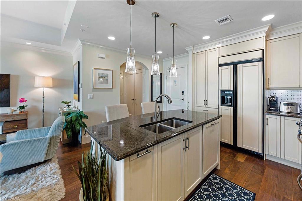 9115 Strada Place, Unit 5501 Naples, FL 34108 - Photo 7 of 31 a kitchen with counter top space and a sink