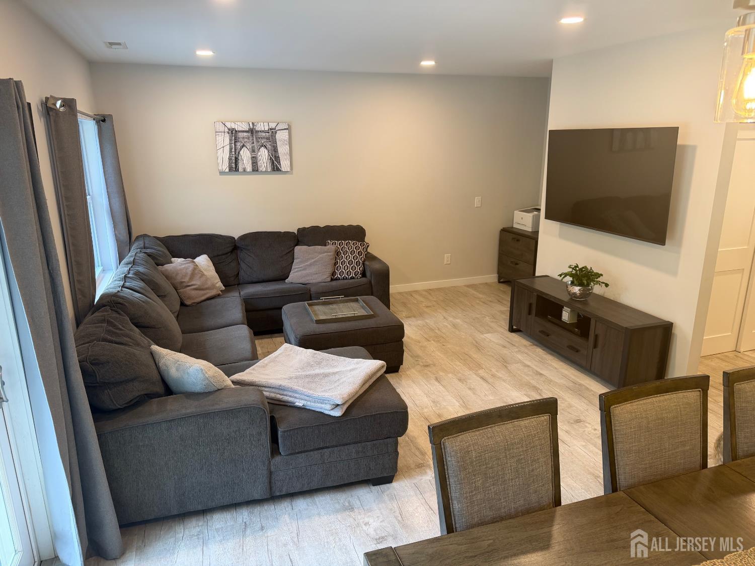 566 Ticetown Road Old Bridge, NJ 08857 - Photo 4 of 23 a living room with furniture and a flat screen tv