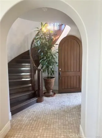 a bedroom with a bed window and a couch