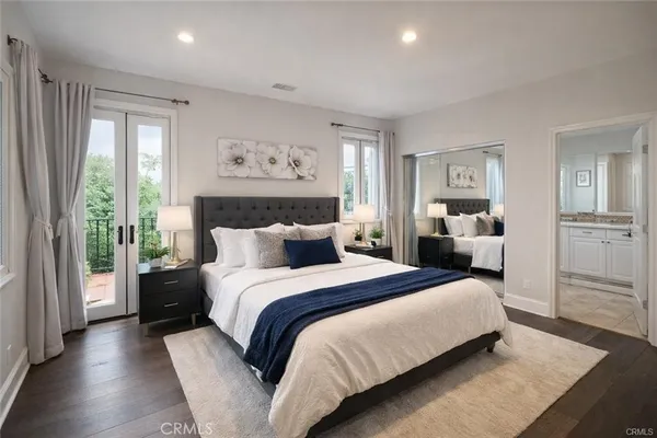 a bedroom with bed and window