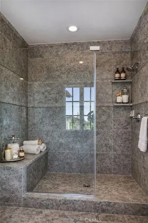 a bathroom with a double vanity sink toilet and a mirror