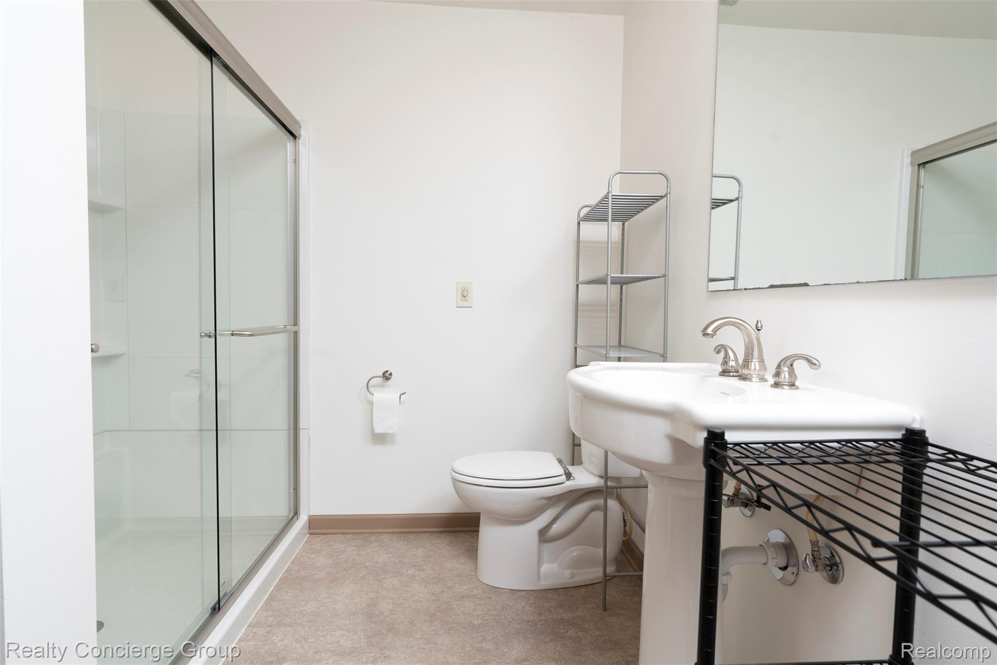 2110 East Clyde Road Howell, MI 48855 - Photo 12 of 44 Private master bath offers large walk-in shower w/ sliding glass doors