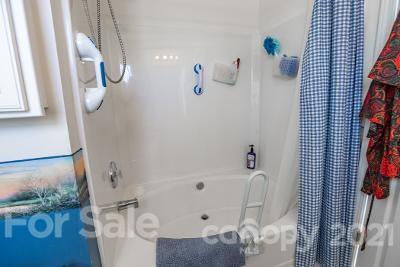 923 Azurine Circle Fort Mill, SC 29708 - Photo 18 of 32 a bathroom with a bathtub and shower