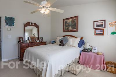 923 Azurine Circle Fort Mill, SC 29708 - Photo 21 of 32 a bedroom with a bed and a chandelier