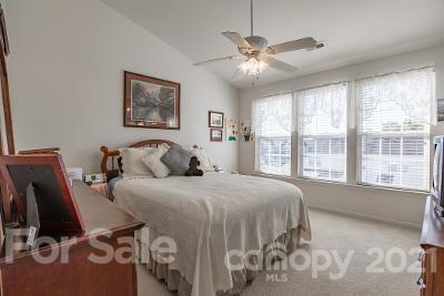 923 Azurine Circle Fort Mill, SC 29708 - Photo 22 of 32 a spacious bedroom with a bed and a large window