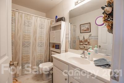923 Azurine Circle Fort Mill, SC 29708 - Photo 30 of 32 a bathroom with a sink vanity mirror and toilet