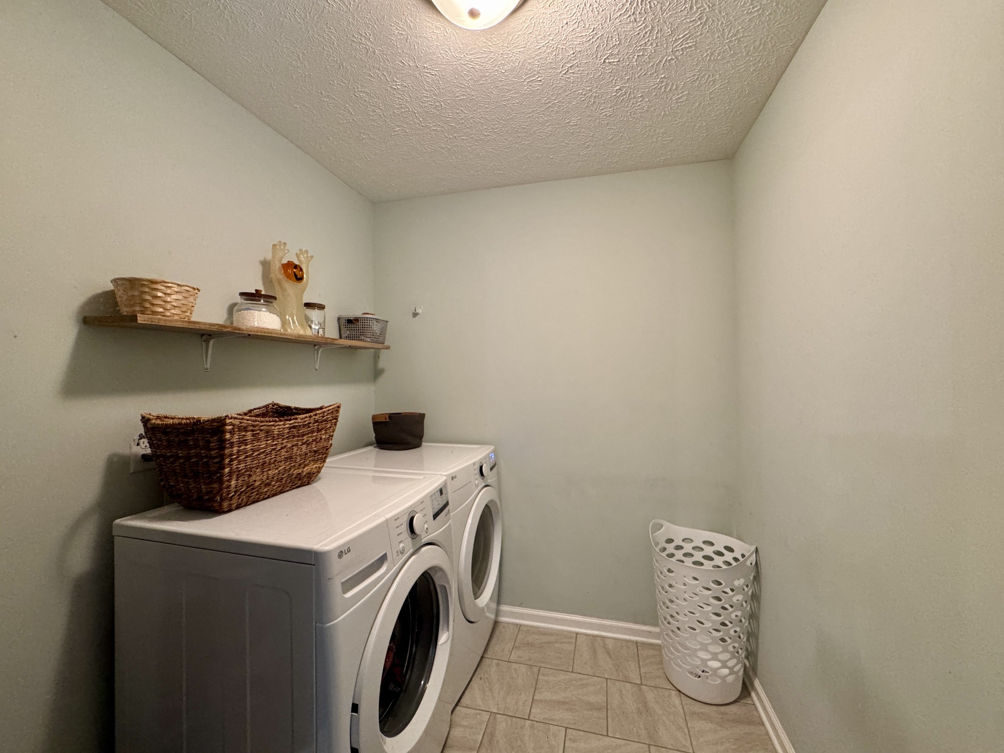 1119 Smiley Troutt Road Bethpage, TN 37022 - Photo 9 of 21 a utility room with dryer and washer