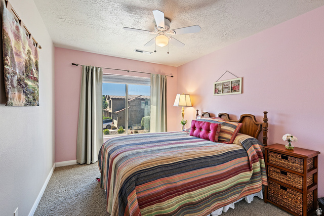 2484 Manzoni Road Santa Clara, UT 84765 - Photo 26 of 27 Bedroom with carpet flooring, a ceiling fan, and a textured ceiling