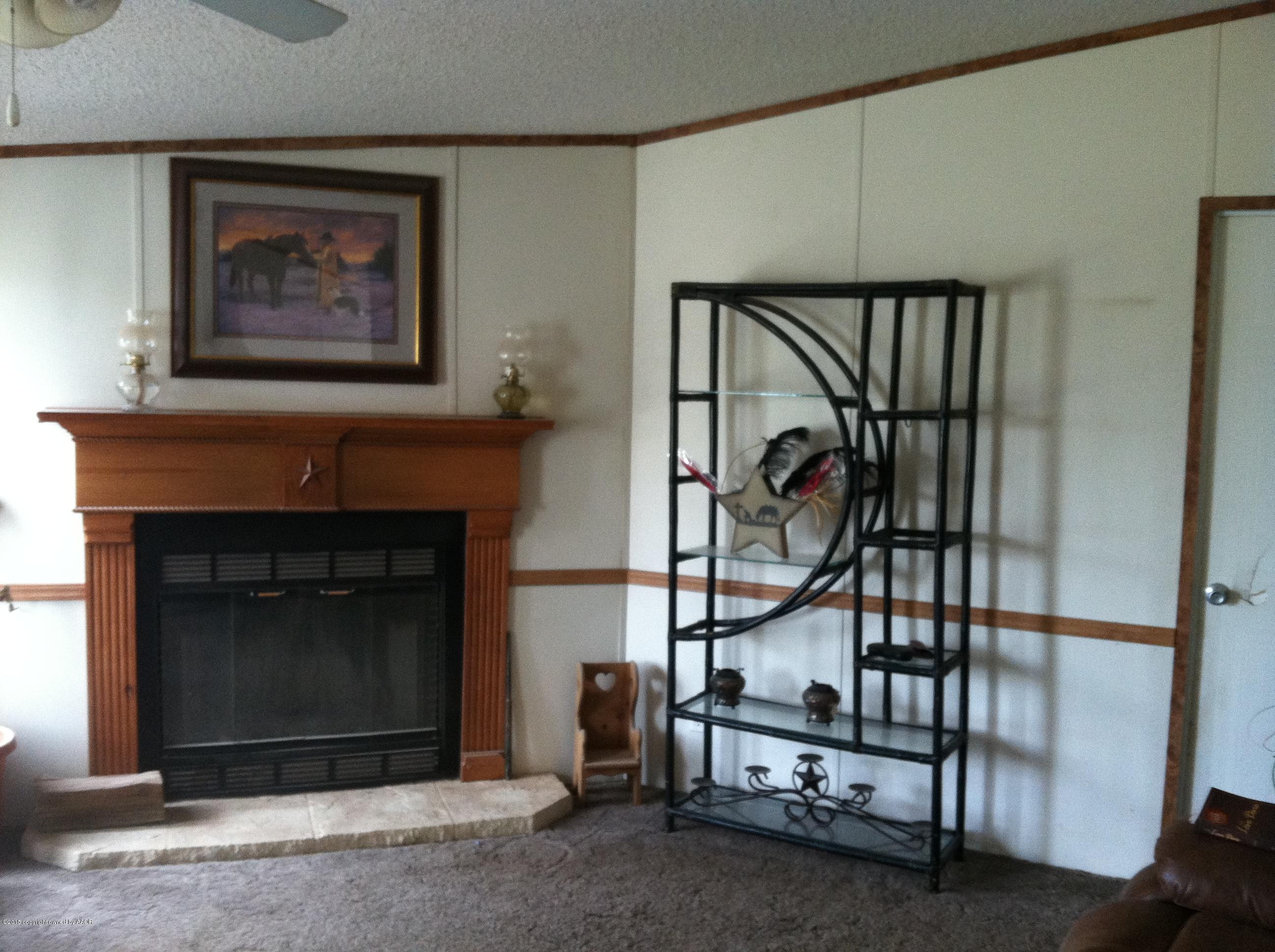 91 Chattanooga Road Amarillo, TX 79118 - Photo 11 of 28 a living room with a fireplace