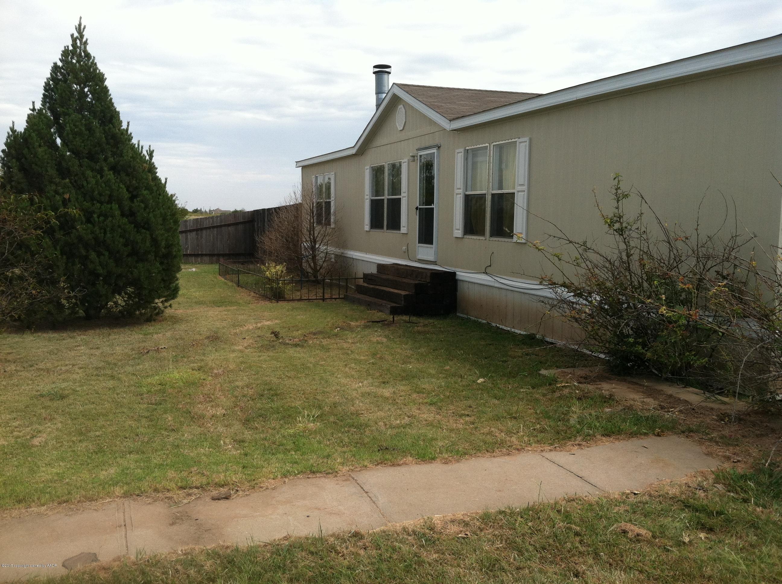 91 Chattanooga Road Amarillo, TX 79118 - Photo 26 of 28 a front view of a house with a yard