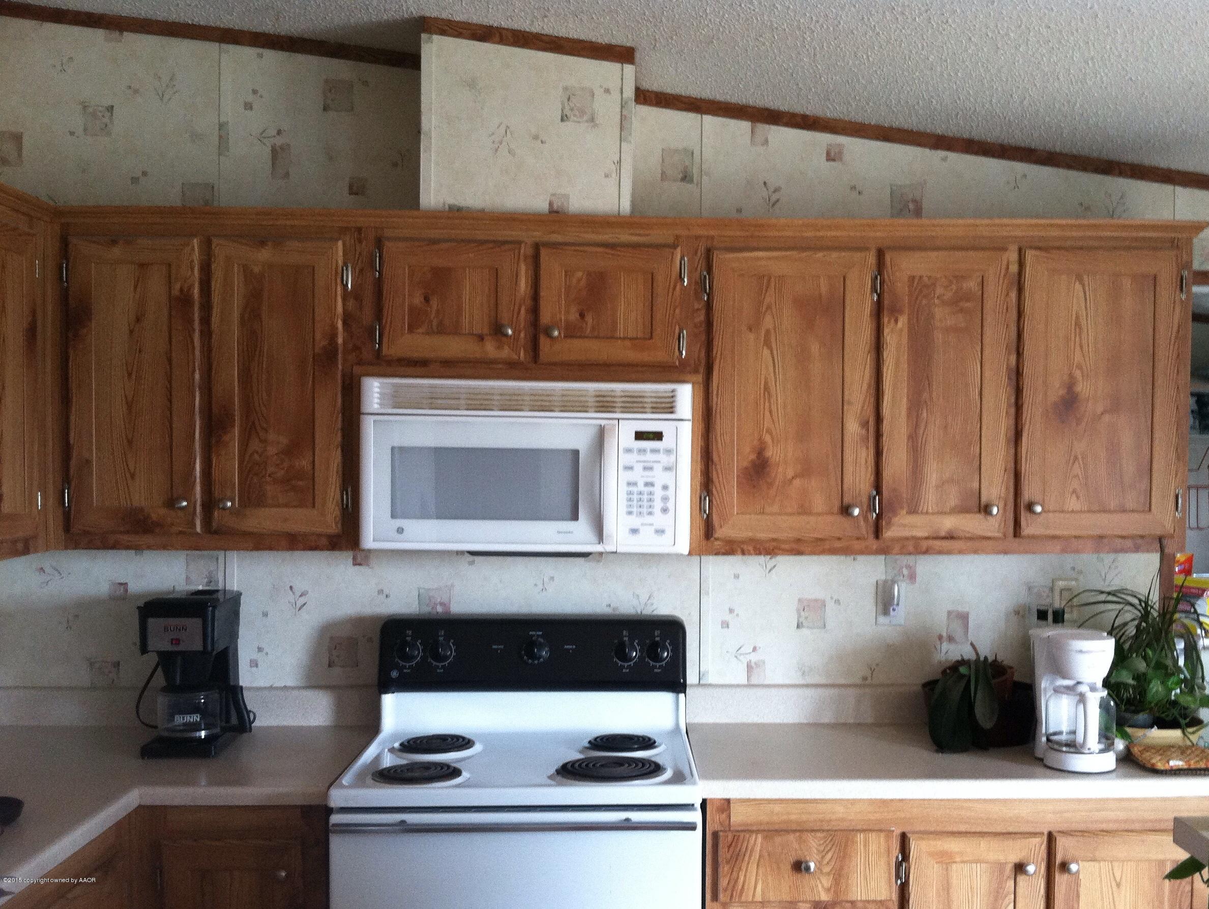 91 Chattanooga Road Amarillo, TX 79118 - Photo 9 of 28 a kitchen with a stove and cabinets