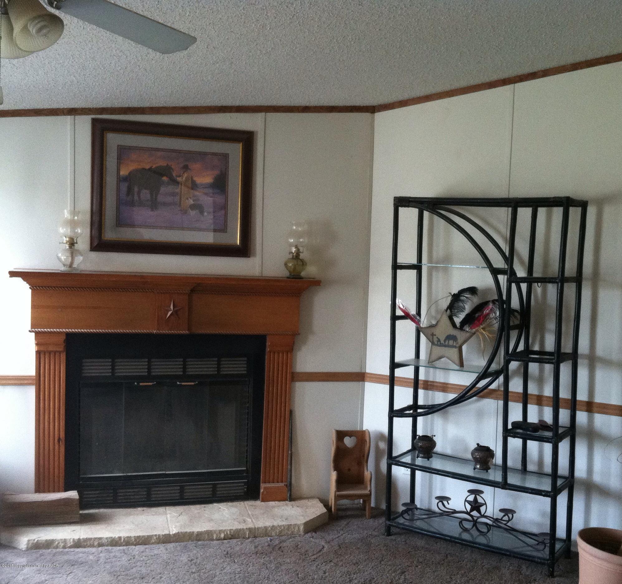 91 Chattanooga Road Amarillo, TX 79118 - Photo 10 of 28 a picture of a living room with a fireplace