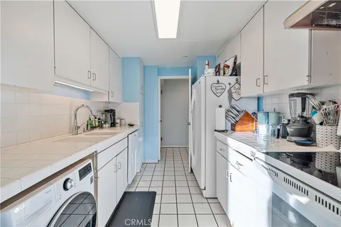 a view of a chairs and table in swimming pool