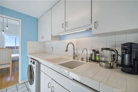 a view of a balcony with furniture and city view