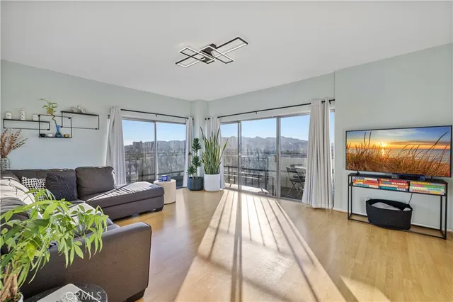 a kitchen with stainless steel appliances granite countertop a stove and cabinets