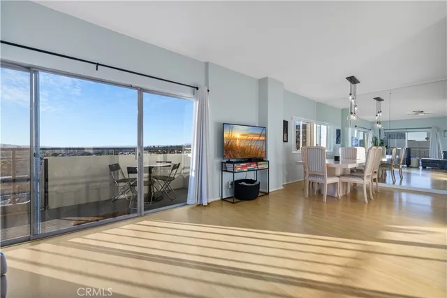 a kitchen with stainless steel appliances granite countertop a sink a stove and a white cabinets
