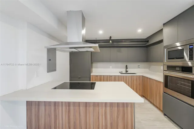 a view of a kitchen with a sink