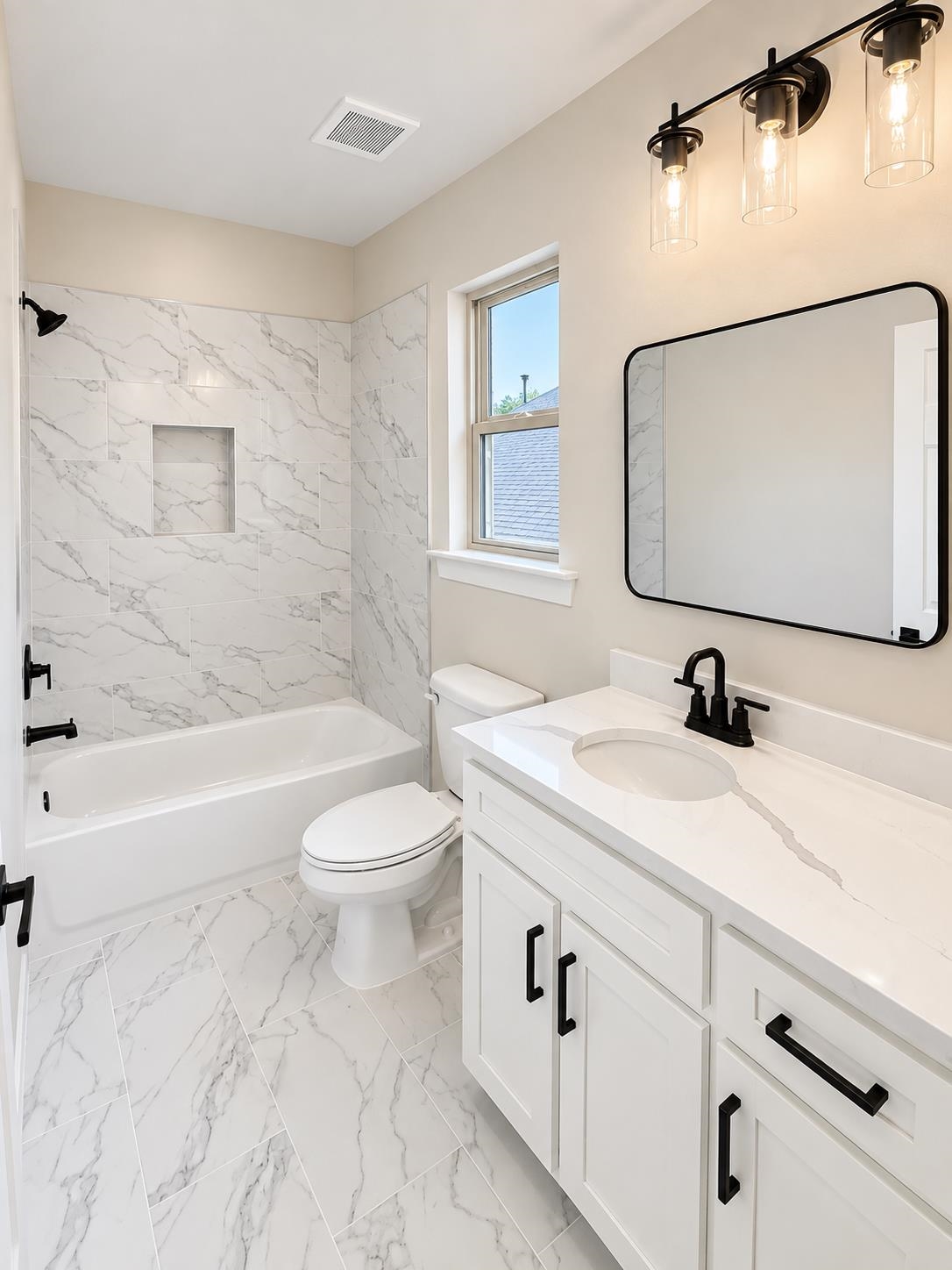 5545 Shipp Road Millington, TN 38053 - Photo 9 of 12 White vanity with black hardware, an integrated sink, and a white countertop