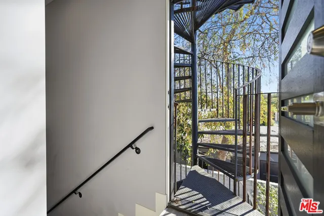 a view of balcony and wooden floor