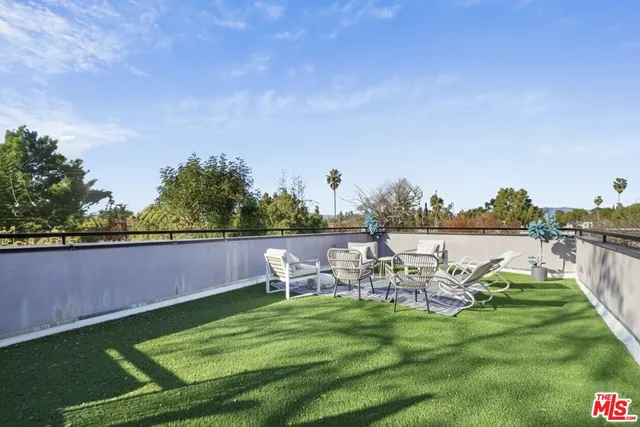 a view of a sitting area with swimming pool and sitting area