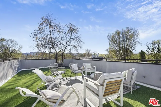 a view of a patio with couches chairs and a table and chairs