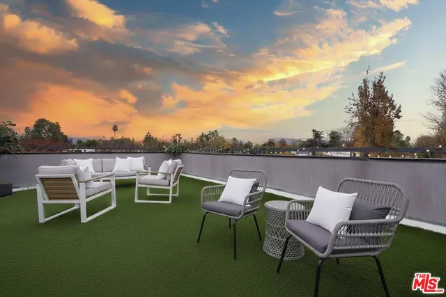 a view of a lake with outdoor seating