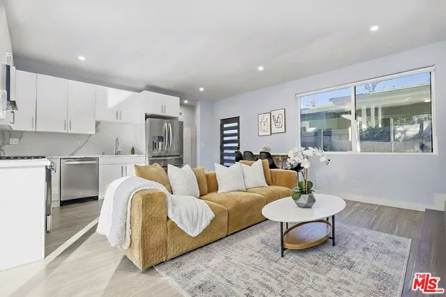 a living room with furniture and a table