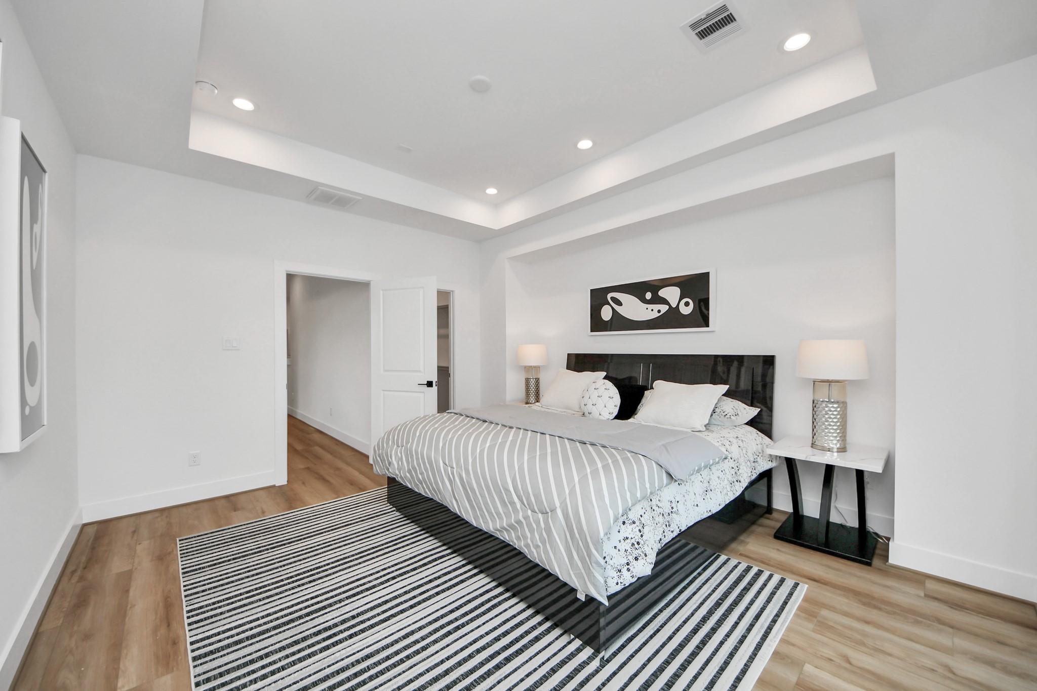 505 Middle Street Houston, TX 77003 - Photo 25 of 46 Experience comfort and style in this elegant primary bedroom, featuring sleek modern design, abundant natural light, and a serene ambiance perfect for relaxation.
