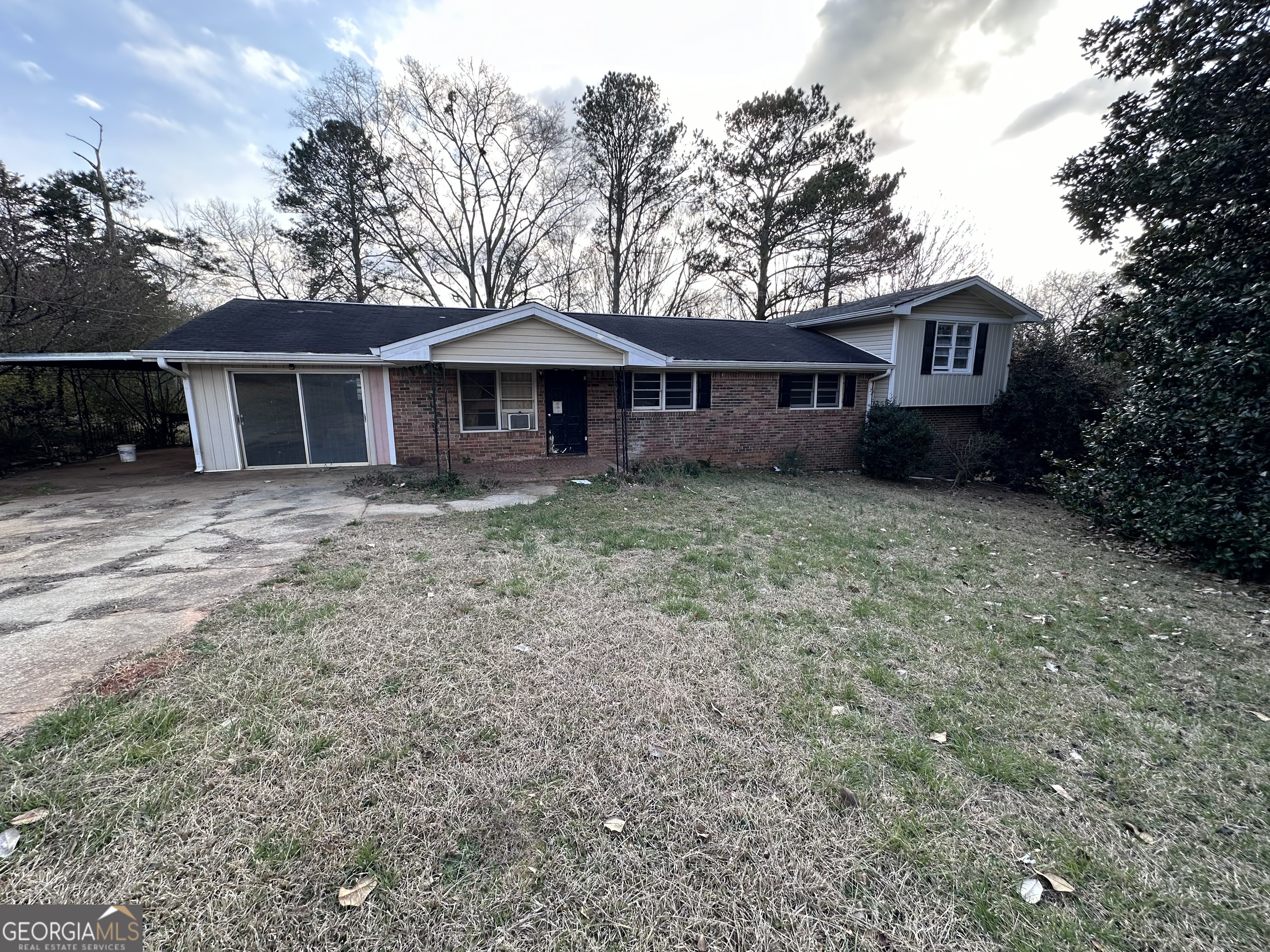 82 West Drive Roopville, GA 30170 - Photo 1 of 1 a house that has a tree in front of it