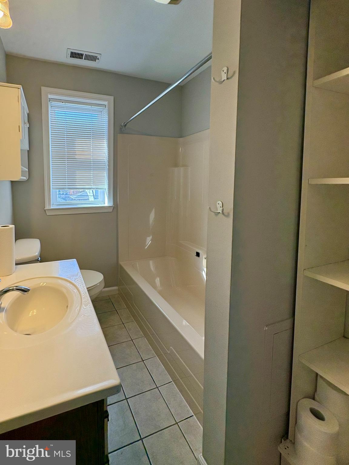 118 Wiltshire Road Baltimore, MD 21221 - Photo 5 of 10 a bathroom with a bathtub and a sink