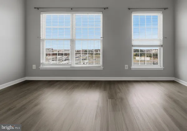 a balcony with wooden floor and fence