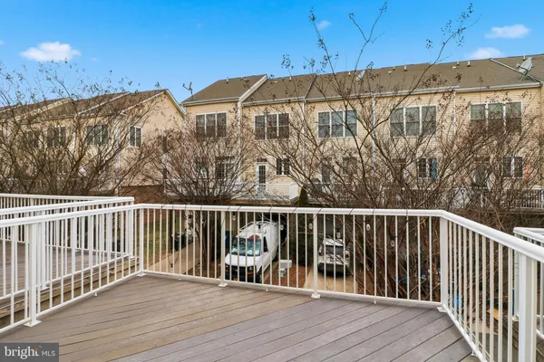 a kitchen with a refrigerator and a sink