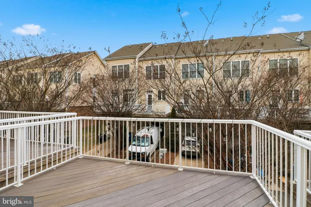 a kitchen with a refrigerator and a sink
