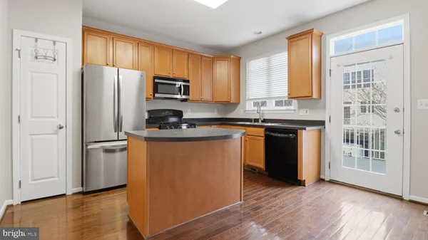 a bathroom with a sink a mirror and shower curtain
