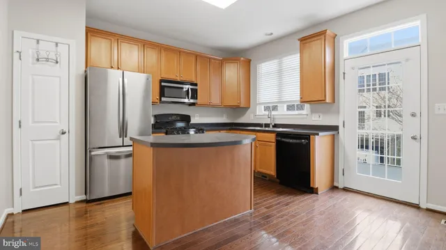 a bathroom with a sink a mirror and shower curtain