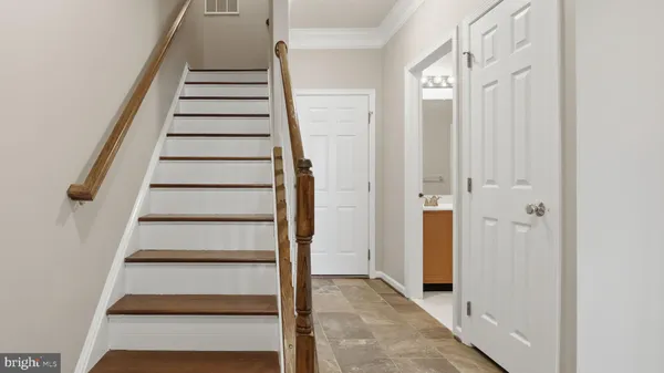 a bedroom with a bed and a potted plant