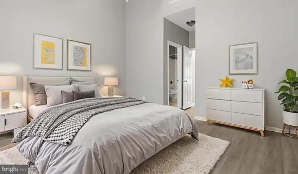 an empty room with wooden floor and closet