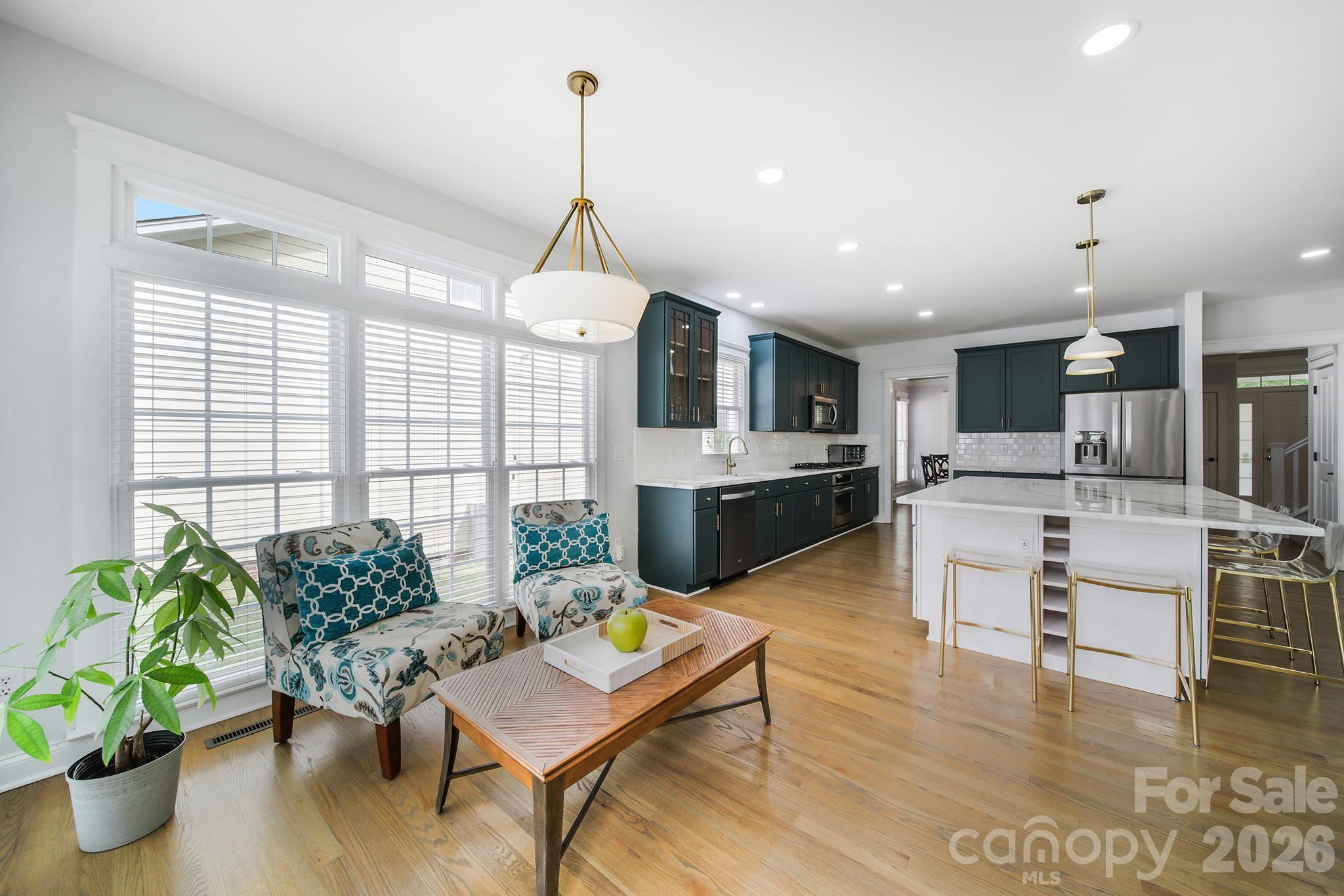 882 Promenade Walk Fort Mill, SC 29708 - Photo 13 of 48 a living room with fireplace furniture and a potted plant