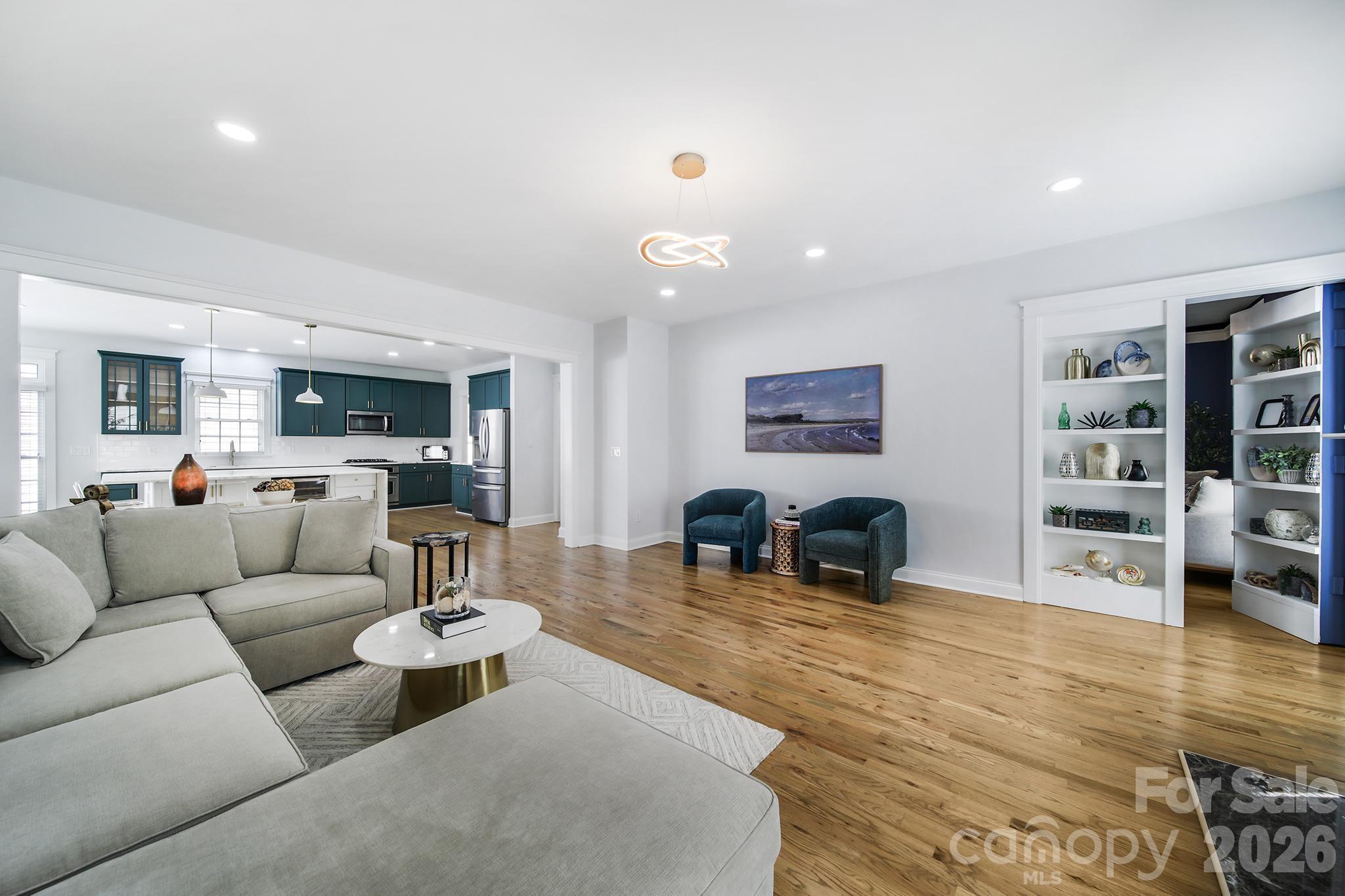 882 Promenade Walk Fort Mill, SC 29708 - Photo 14 of 48 a living room with furniture and a wooden floor