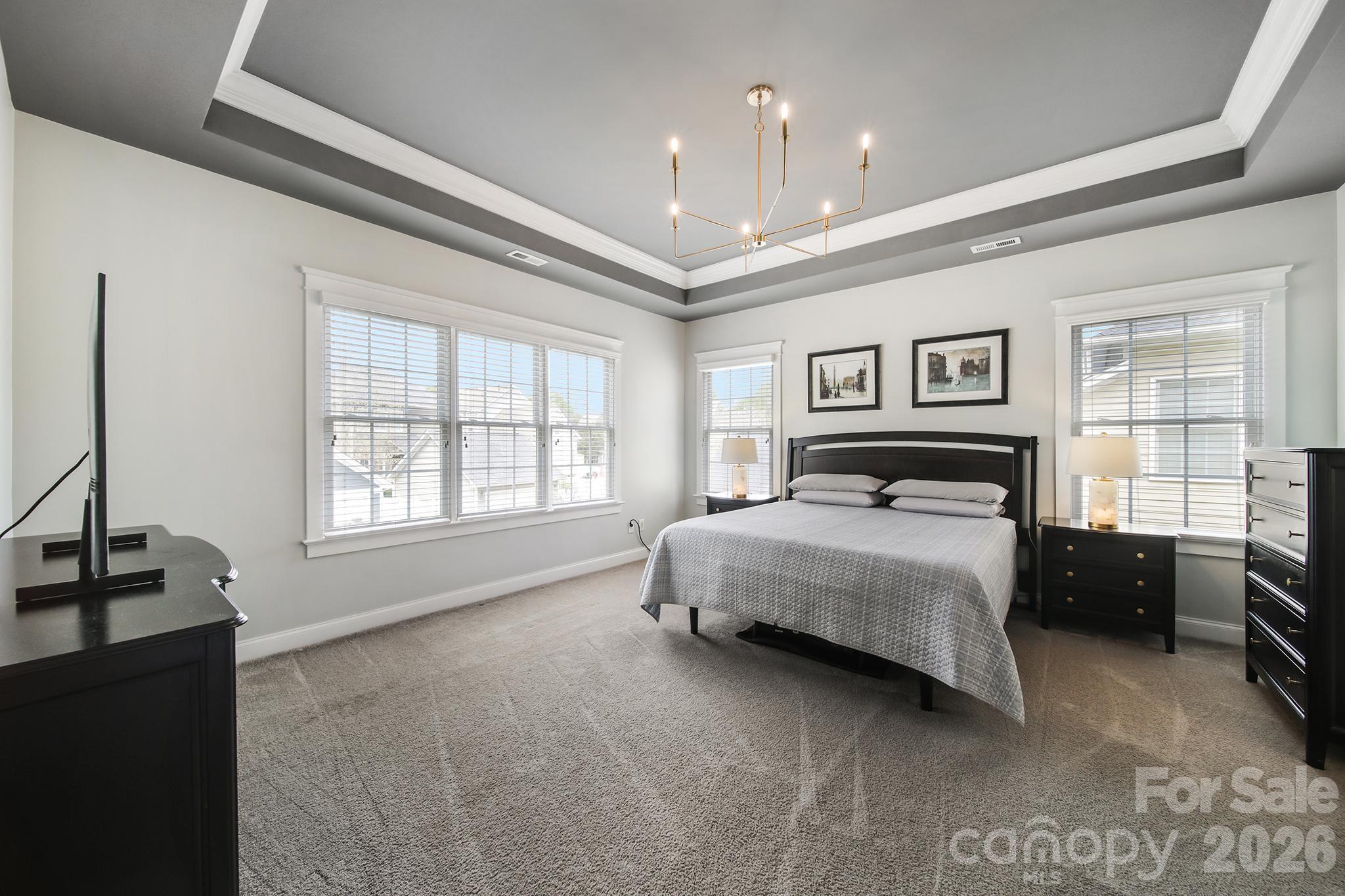 882 Promenade Walk Fort Mill, SC 29708 - Photo 26 of 48 a bedroom with a large bed and a window