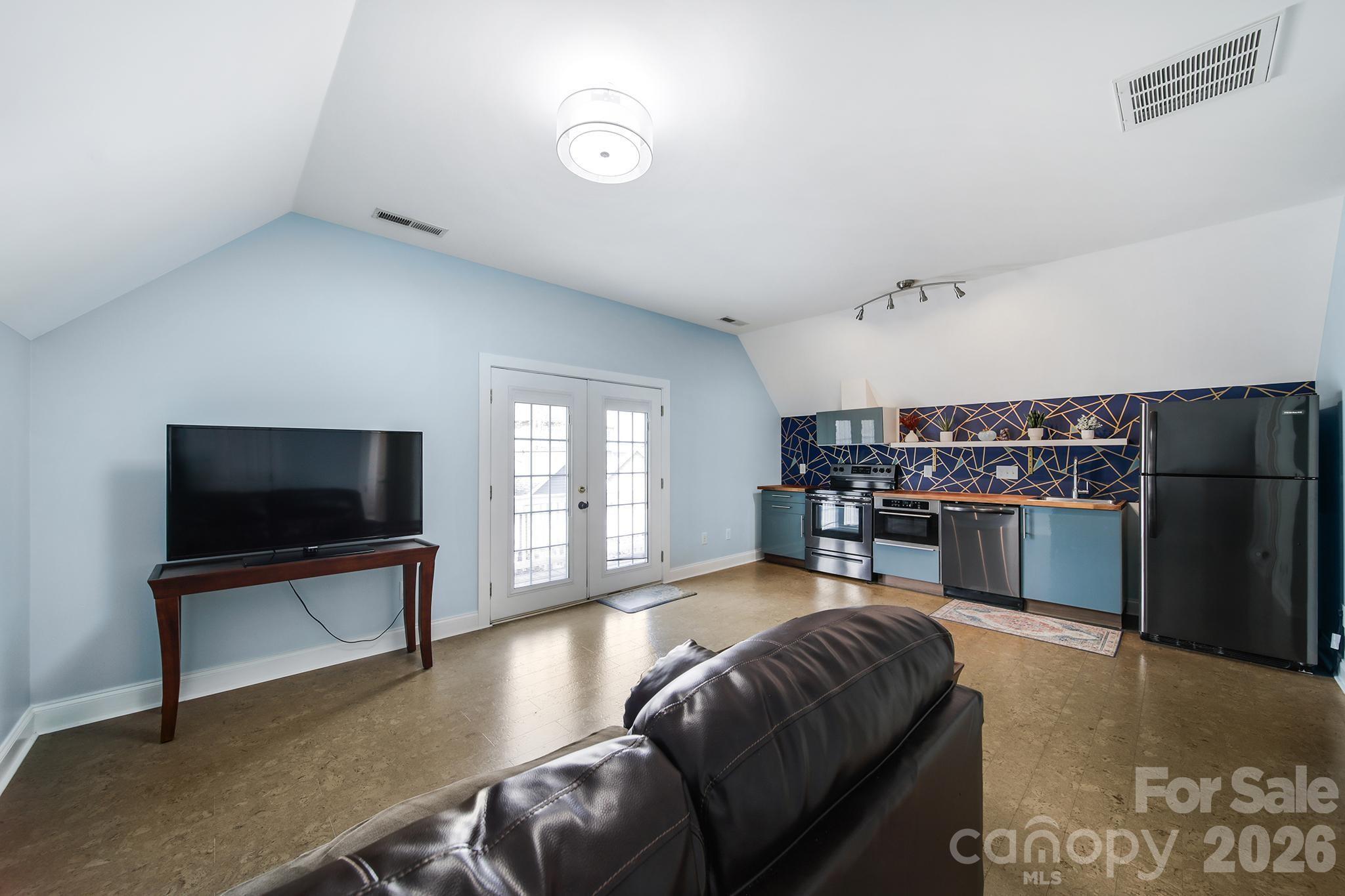 882 Promenade Walk Fort Mill, SC 29708 - Photo 32 of 48 a living room with furniture and a flat screen tv