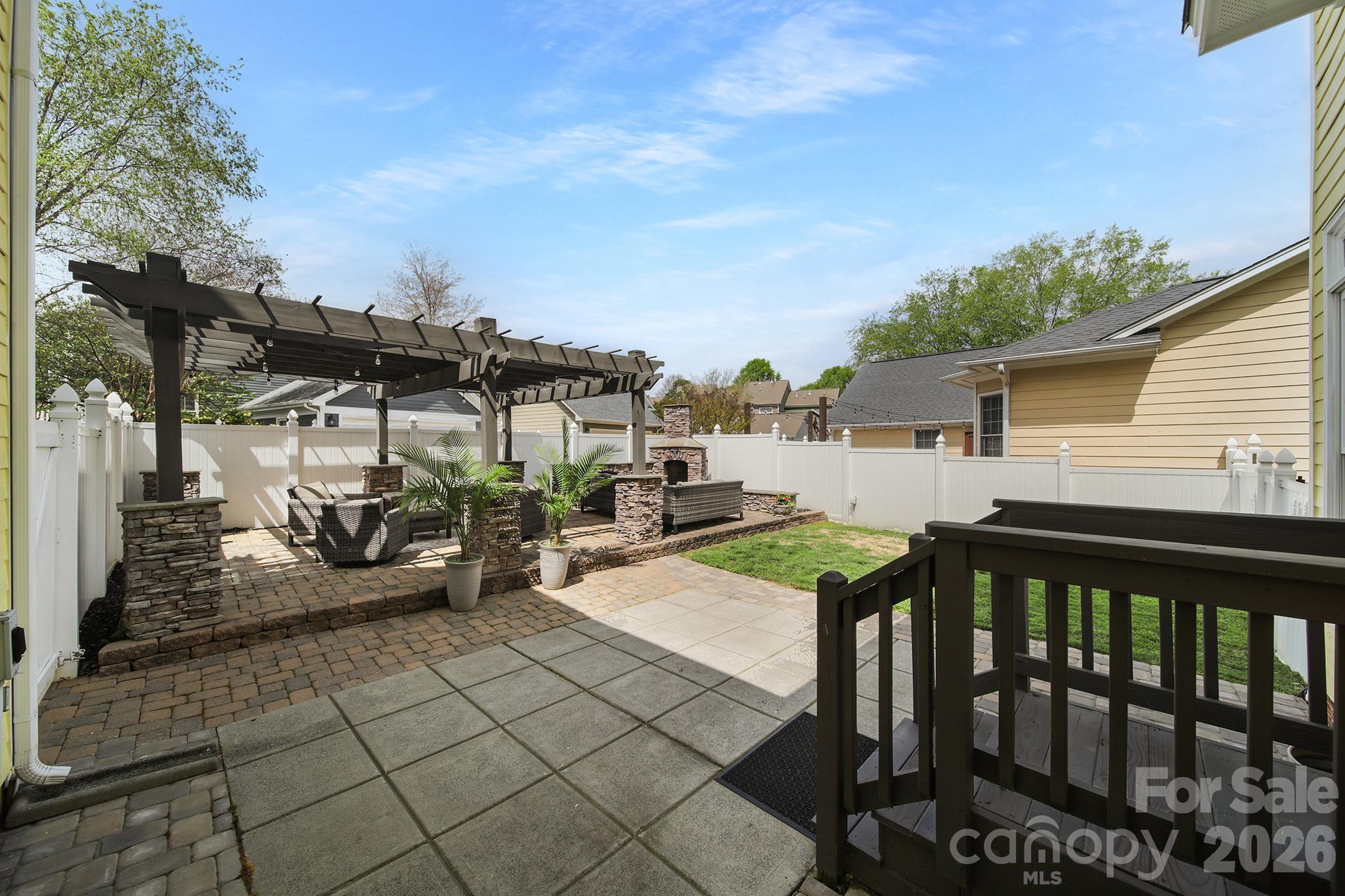 882 Promenade Walk Fort Mill, SC 29708 - Photo 36 of 48 a view of a patio with table and chairs with wooden floor and fence
