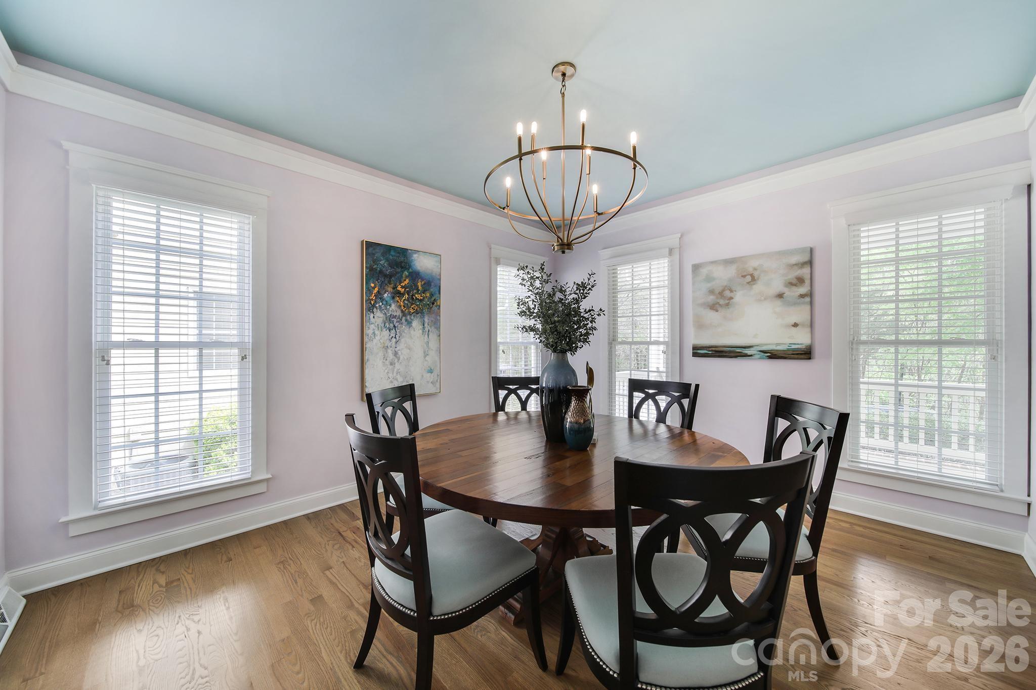 882 Promenade Walk Fort Mill, SC 29708 - Photo 4 of 48 a view of a dining room with furniture wooden floor and chandelier